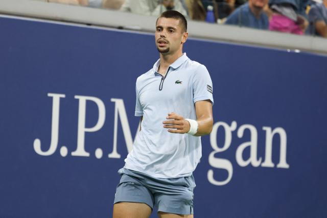 France's Arthur Gea reacts after losing the 3rt set to Netherlands' Botic van de Zandschulp during the men's singles round of 16 tennis match on day nine of the US Open tennis tournament at the USTA Billie Jean King National Tennis Center in New York City on September 7, 2026. (Photo by Leonardo MUNOZ / AFP)