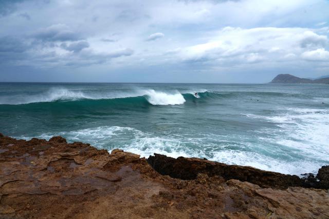 Waves break offshore at Electric Beach in Waianae, Hawaii, on September 7, 2026. A hurricane warning was issued September 7 for the westernmost Hawaiian islands of Kauai and Niihau as Category 3 Hurricane Lowell approached the US Pacific island chain, the National Hurricane Center (NHC) said. The core of Lowell was expected to pass just west of Niihau on the night of September 7 or early on September 8, the center said in its latest bulletin released at 8 am Hawaii time (1800GMT). (Photo by Michelle Bir / AFP)