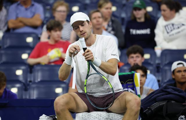 Netherlands' Botic van de Zandschulp adjusts his racket's grip during a break in the men's singles round of 16 tennis match against France's Arthur Gea on day nine of the US Open tennis tournament at the USTA Billie Jean King National Tennis Center in New York City on September 7, 2026. (Photo by Leonardo MUNOZ / AFP)
