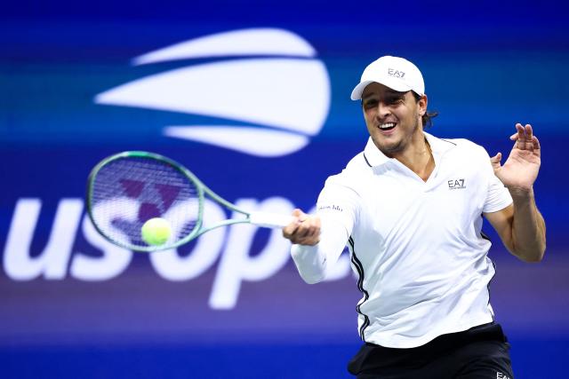 Italy's Luciano Darderi hits a forehand return during the men's singles round of 16 tennis match against Germany's Alexander Zverev on day nine of the US Open tennis tournament at the USTA Billie Jean King National Tennis Center in New York City on September 7, 2026. (Photo by CHARLY TRIBALLEAU / AFP)