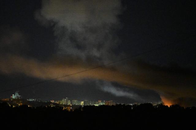 This photograph shows fire and smoke rising following Russian missiles strike in Kyiv, Ukraine, early on September 8, 2026, amid Russian invasion in Ukraine. A wave of strong explosions rang out in Kyiv, AFP journalists said, as Russia resumed strikes on the Ukrainian capital after a three-day halt. Russian President Vladimir Putin had ordered the pause in attacks as US President Donald Trump's envoys Steve Witkoff and Jared Kushner visited the Russian and Ukrainian capitals at the weekend. (Photo by Genya Savilov / AFP)