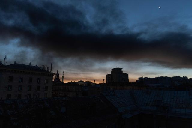 This photograph shows smoke rising over buildings following Russian air attacks, in downtown Kyiv on September 8, 2026, amid the Russian invasion of Ukraine. A series of "strong" explosions rang out in Kyiv, AFP journalists said early September 8, as Russia resumed strikes on the Ukrainian capital after a three-day halt. (Photo by Roman PILIPEY / AFP)