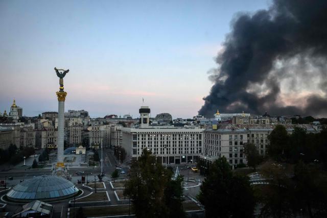 This photograph shows smoke rising over buildings following Russian air attacks, in downtown Kyiv on September 8, 2026, amid the Russian invasion of Ukraine. A series of "strong" explosions rang out in Kyiv, AFP journalists said early on September 8, as Russia resumed strikes on the Ukrainian capital after a three-day halt. (Photo by Mladen ANTONOV / AFP)