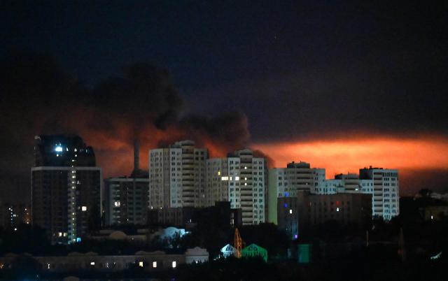 This photograph shows fire and smoke rising following Russian missiles strike in Kyiv, Ukraine, early on September 8, 2026, amid Russian invasion in Ukraine. A wave of strong explosions rang out in Kyiv, AFP journalists said, as Russia resumed strikes on the Ukrainian capital after a three-day halt. Russian President Vladimir Putin had ordered the pause in attacks as US President Donald Trump's envoys Steve Witkoff and Jared Kushner visited the Russian and Ukrainian capitals at the weekend. (Photo by Sergei SUPINSKY / AFP)