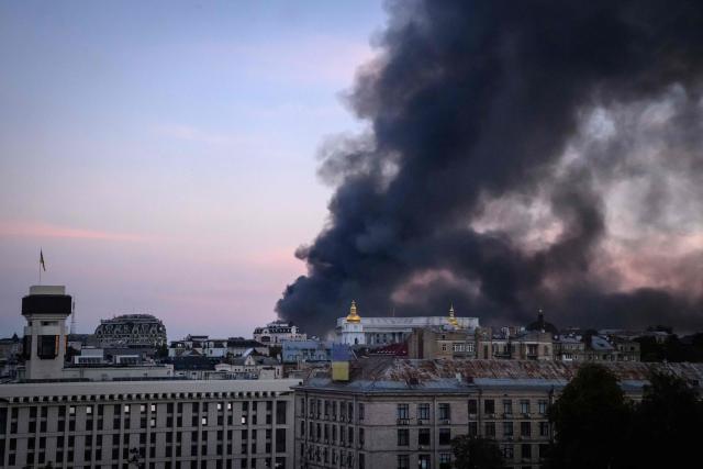 This photograph shows smoke rising over buildings following Russian air attacks, in downtown Kyiv on September 8, 2026, amid the Russian invasion of Ukraine. A series of "strong" explosions rang out in Kyiv, AFP journalists said early on September 8, as Russia resumed strikes on the Ukrainian capital after a three-day halt. (Photo by Mladen ANTONOV / AFP)