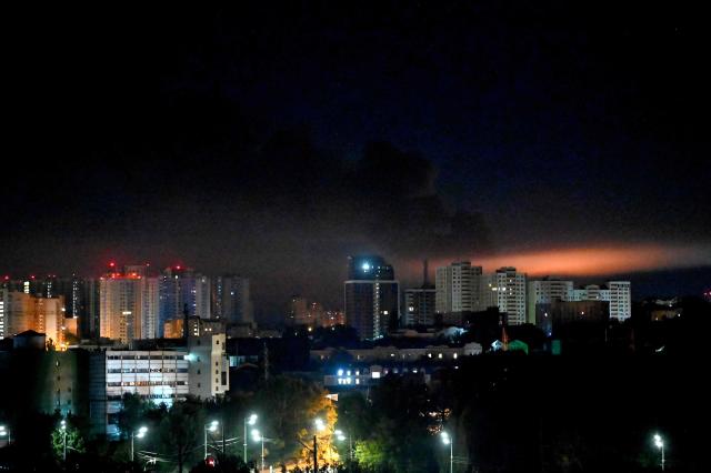 This photograph shows fire and smoke rising following Russian missiles strike in Kyiv, Ukraine, early on September 8, 2026, amid Russian invasion in Ukraine. A wave of strong explosions rang out in Kyiv, AFP journalists said, as Russia resumed strikes on the Ukrainian capital after a three-day halt. Russian President Vladimir Putin had ordered the pause in attacks as US President Donald Trump's envoys Steve Witkoff and Jared Kushner visited the Russian and Ukrainian capitals at the weekend. (Photo by Sergei SUPINSKY / AFP)