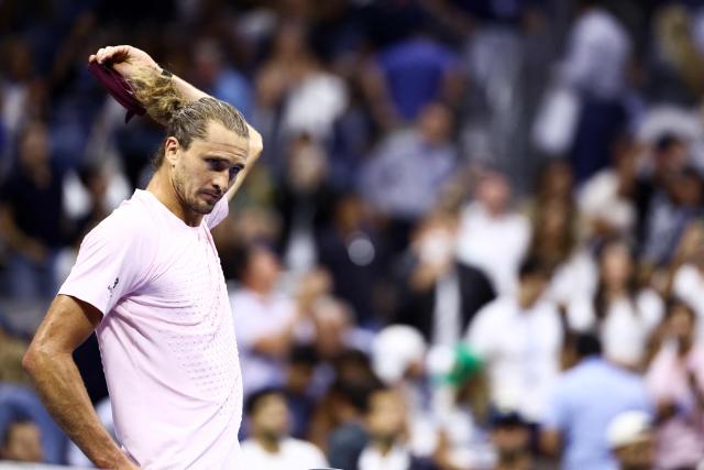 Germany's Alexander Zverev removes his headband after the men's singles round of 16 tennis match against Italy's Luciano Darderi on day nine of the US Open tennis tournament at the USTA Billie Jean King National Tennis Center in New York City on September 7, 2026. (Photo by CHARLY TRIBALLEAU / AFP)