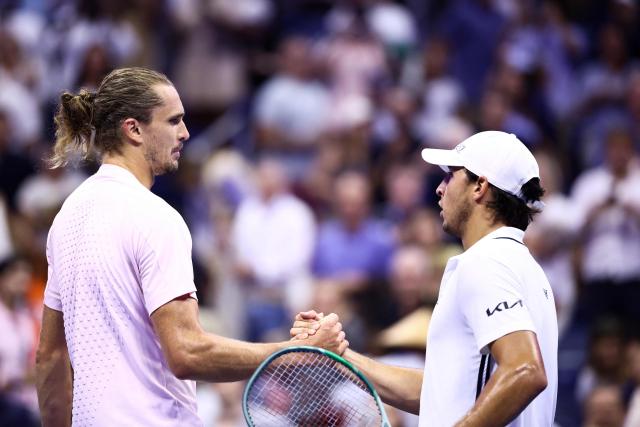 Germany's Alexander Zverev shakes hands with Italy's Luciano Darderi after the men's singles round of 16 tennis match on day nine of the US Open tennis tournament at the USTA Billie Jean King National Tennis Center in New York City on September 7, 2026. (Photo by CHARLY TRIBALLEAU / AFP)