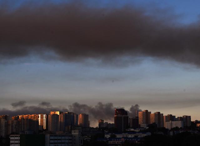 This photograph shows smoke rising following Russian missiles strike in Kyiv, Ukraine, early on September 8, 2026, amid the Russian invasion in Ukraine. A wave of strong explosions rang out in Kyiv, AFP journalists said early on September 8, as Russia resumed strikes on the Ukrainian capital after a three-day halt. (Photo by Sergei SUPINSKY / AFP)