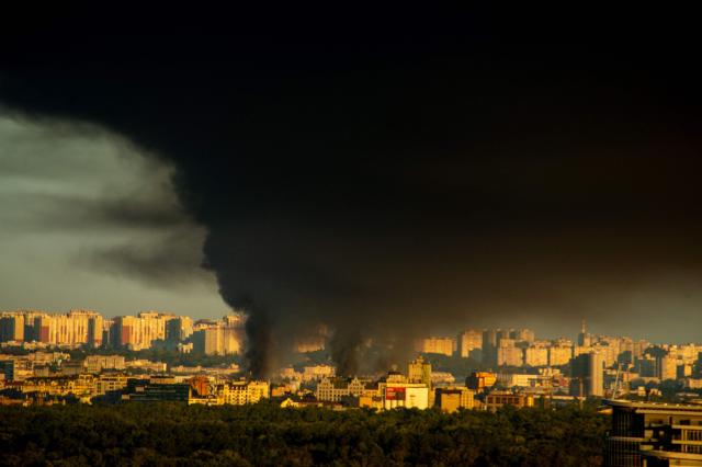 This photograph shows smoke rising following Russian missiles strike in Kyiv, Ukraine, early on September 8, 2026, amid Russian invasion in Ukraine. A wave of strong explosions rang out in Kyiv, AFP journalists said, as Russia resumed strikes on the Ukrainian capital after a three-day halt. Russian President Vladimir Putin had ordered the pause in attacks as US President Donald Trump's envoys Steve Witkoff and Jared Kushner visited the Russian and Ukrainian capitals at the weekend. (Photo by Eugene KOTENKO / AFP)