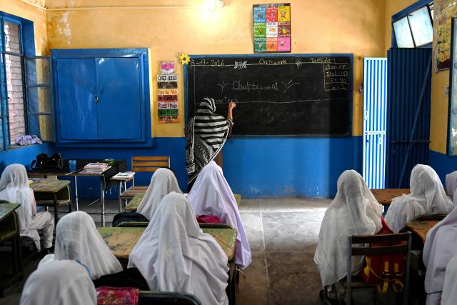 Students attend a class at a school in Peshawar on September 8, 2026, marking the International Literacy Day. (Photo by Abdul MAJEED / AFP)
