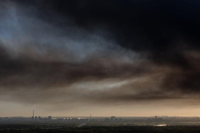 Smoke rises over the city following a Russian air attack on Kyiv on September 8, 2026, amid the Russian invasion of Ukraine. A wave of strong explosions rang out in Kyiv, AFP journalists said, as Russia resumed strikes on the Ukrainian capital after a three-day halt. Russian President Vladimir Putin had ordered the pause in attacks as US President Donald Trump's envoys Steve Witkoff and Jared Kushner visited the Russian and Ukrainian capitals at the weekend. (Photo by Roman PILIPEY / AFP)