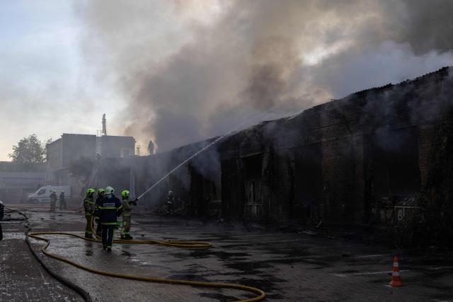 Firefighters push out a fire following Russian missiles strikes in Kyiv early on September 8, 2026, amid the Russian invasion in Ukraine. A wave of strong explosions rang out in Kyiv, AFP journalists said early on September 8, as Russia resumed strikes on the Ukrainian capital after a three-day halt. (Photo by Serhii Okunev / AFP)