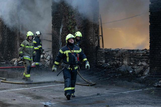 Firefighters are at work to push out a fire following Russian missiles strikes in Kyiv early on September 8, 2026, amid the Russian invasion in Ukraine. A wave of strong explosions rang out in Kyiv, AFP journalists said early on September 8, as Russia resumed strikes on the Ukrainian capital after a three-day halt. (Photo by Serhii Okunev / AFP)