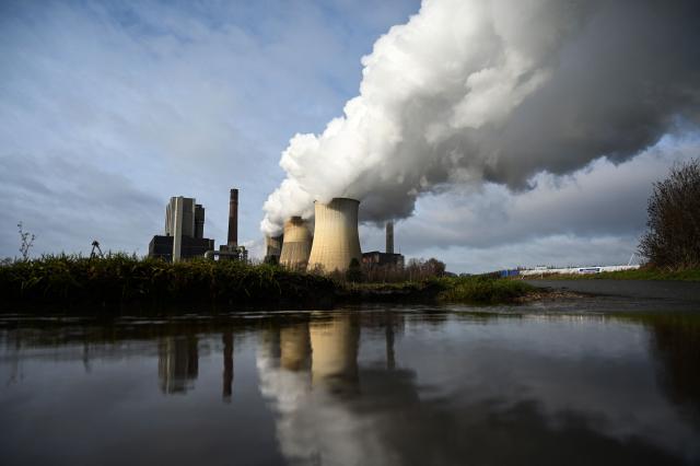 (FILES) Steam rises from the cooling towers of the coal-fired power station of German energy giant RWE in Weisweiler, western Germany, on January 26, 2021. German police said on September 8, 2026 they had arrested a suspect person in connection with sabotage attacks on power lines. Germany has been rattled by attacks on electricity substations across the country which were apparently aimed at cutting power from coal-fired power stations and causing widespread blackouts. Authorities said the attacks were likely a case of "climate extremism", after a 48-year-old man, named in German media as Daniel V., sent letters claiming responsibility for the acts and suspected explosives were found during searches of his apartment. (Photo by Ina FASSBENDER / AFP)