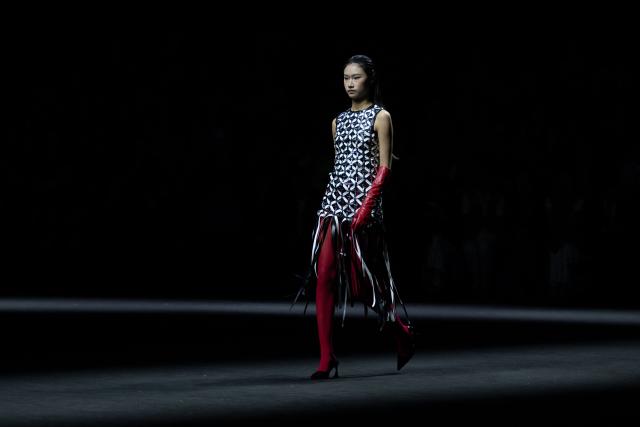 A model displays a creation from the Weilei collection by Bao Lei during the China Fashion week in Beijing on September 8, 2026. (Photo by WANG Zhao / AFP)
