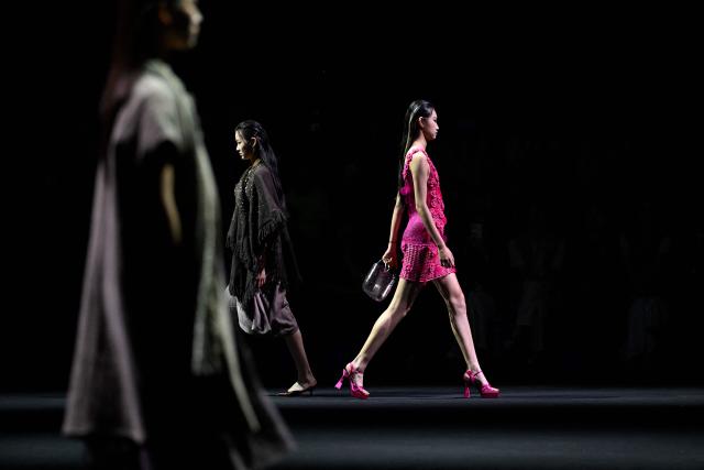 Models display creations from the Weilei collection by Bao Lei during the China Fashion week in Beijing on September 8, 2026. (Photo by WANG Zhao / AFP)