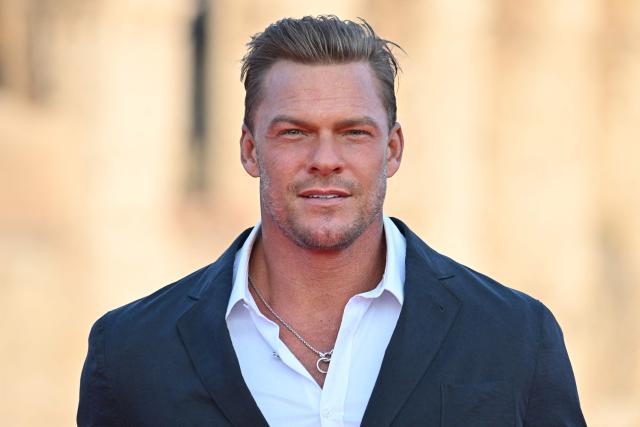 (FILES) US actor and singer Alan Ritchson arrives for the Premiere of the film "Fast X", the tenth film in the Fast & Furious Saga, on May 12, 2023 at the Colosseum monument in Rome. When Owen Wilson signed on to do a buddy action thriller with muscular "Reacher" star Alan Ritchson, he understood very quickly there would have to be a strict division of labor on set. (Photo by Alberto PIZZOLI / AFP)