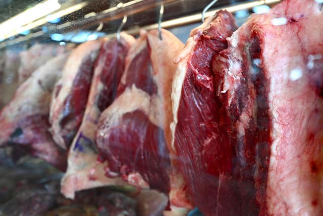 Cuts of meat are displayed in a butcher shop window in Brasilia on September 3, 2026. While campaigning in 2022, Brazil's President Luiz Inacio Lula da Silva vowed to put "picanha" on the plates of the people but that promise has come back to haunt him as the price of Brazilians' favorite cut of beef -- a slab of rump bordered by a cap of fat -- creeps higher. (Photo by Evaristo Sa / AFP)
