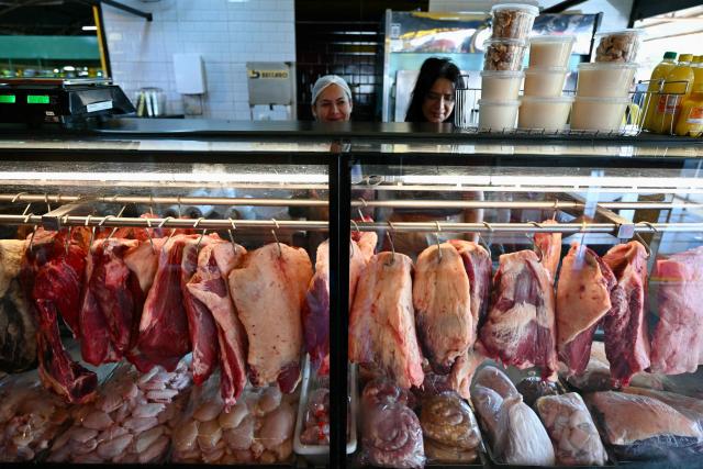 Cuts of meat are displayed in a butcher shop window in Brasilia on September 3, 2026. While campaigning in 2022, Brazil's President Luiz Inacio Lula da Silva vowed to put "picanha" on the plates of the people but that promise has come back to haunt him as the price of Brazilians' favorite cut of beef -- a slab of rump bordered by a cap of fat -- creeps higher. (Photo by Evaristo Sa / AFP)