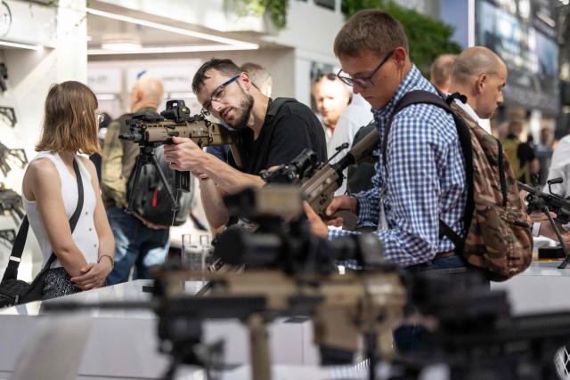 A man tries out a rifle at one of the stands on the first day of the 34th International Defence Industry Exhibition in Kielce, Poland, on September 8, 2026. The 34th International Defence Industry Exhibition runs from September 8 to 11, 2026 in Kielce, Poland. (Photo by Wojtek RADWANSKI / AFP)