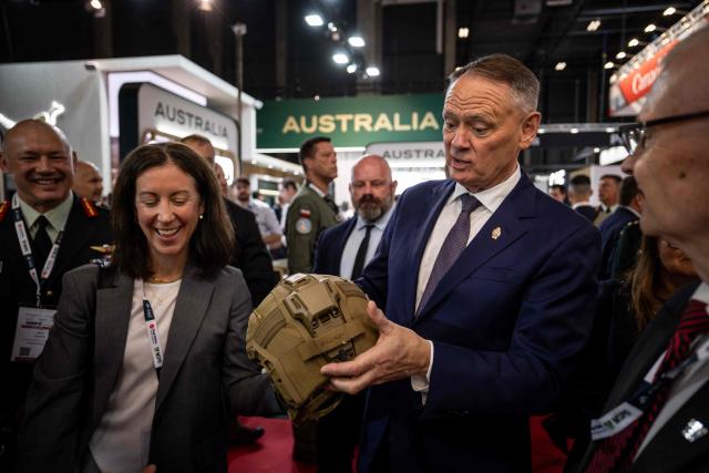 Canada’s Defence Minister David McGuinty (R) holds combat helmet and speaks to the exhibitors on the first day of the 34th International Defence Industry Exhibition in Kielce, Poland, on 8 September 2026. The 34th International Defence Industry Exhibition runs from September 8 to 11, 2026 in Kielce, Poland. (Photo by Wojtek RADWANSKI / AFP)