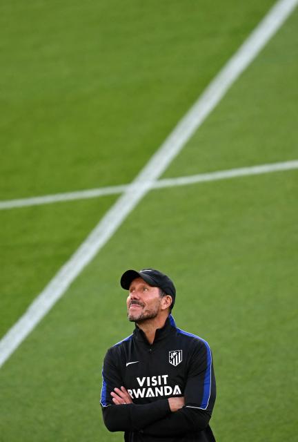Atletico Madrid's Argentinian coach Diego Simeone takes a team training session on the pitch at Anfield stadium in Liverpool, north-west England on September 8, 2026, on the eve of their UEFA Champions League, first round football match against Liverpool. (Photo by Paul ELLIS / AFP)