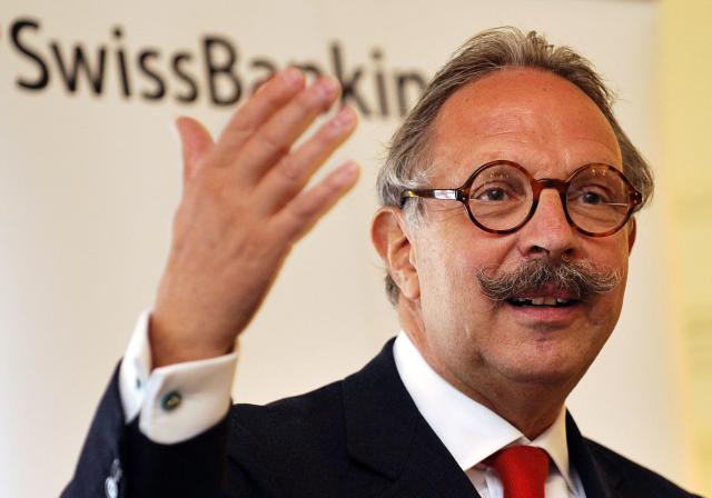 (FILES) Swiss Bankers Association President Pierre Mirabaud gestures as he addresses media representatives during a press conference in Geneva on May 5, 2008. The former head of the Swiss Bankers Association was given a two-year suspended jail sentence for corruption and money laundering on September 8, 2026, in a in a bribery case involving a former director of Kuwaiti social security. (Photo by Fabrice COFFRINI / AFP)