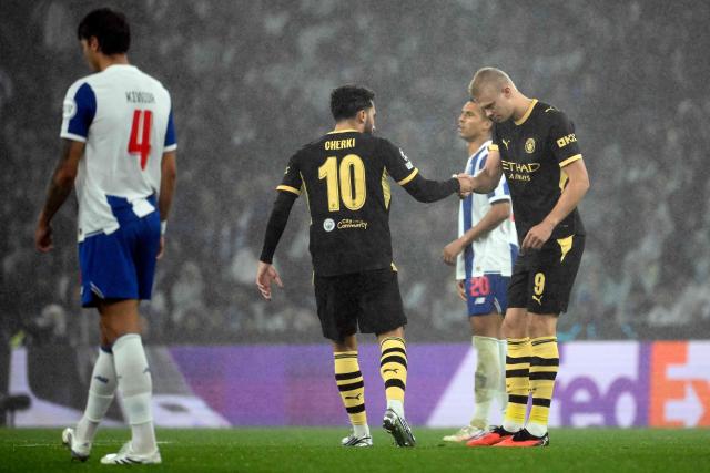 Manchester City's Norwegian forward #09 Erling Haaland shakes hands with Manchester City's French midfielder #10 Ryan Cherki as he celebrates scoring the opening goal during the UEFA Champions League first round day 1 football match between FC Porto and Manchester City at Dragao stadium in Porto on September 8, 2026. (Photo by Miguel RIOPA / AFP)