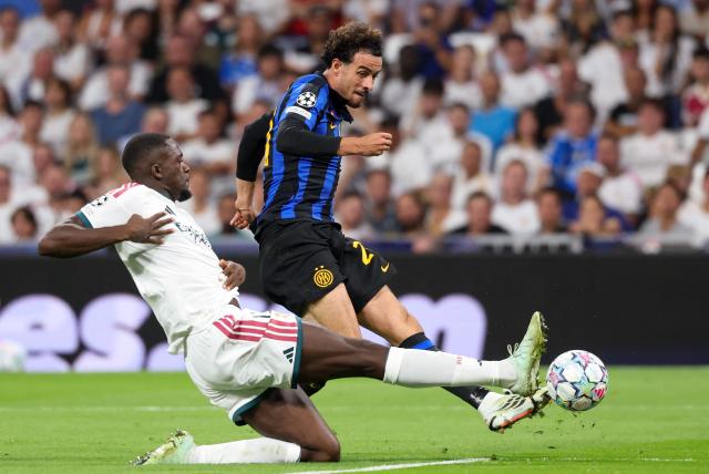 Real Madrid's French defender #16 Ibrahima Konate (L) challenges Real Madrid's Moroccan forward #21 Brahim Diaz during the UEFA Champions League first round day 1 football match between Real Madrid and Inter Milan at the Santiago Bernabeu stadium in Madrid on September 8, 2026. (Photo by Pierre-Philippe MARCOU / AFP)