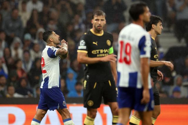 FC Porto's Argentine midfielder #22 Alan Varela reacts after missing a goal opportunity during the UEFA Champions League first round day 1 football match between FC Porto and Manchester City at Dragao stadium in Porto on September 8, 2026. (Photo by PATRICIA DE MELO MOREIRA / AFP)