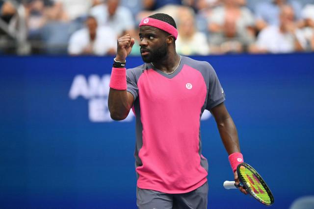 USA's Frances Tiafoe reacts as he plays USA's Alex Michelsen in their men's singles quarter-final tennis match on day ten of the US Open tennis tournament at the USTA Billie Jean King National Tennis Center in New York on September 8, 2026. (Photo by ANGELA WEISS / AFP)
