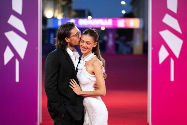 British personality Brooklyn Beckham (L) and US model Nicola Peltz (R) kiss on the red carpret during the 52nd edition of the Deauville American film festival, in Deauville, northwestern France on September 8, 2026. (Photo by Guillaume SALIGOT / AFP)