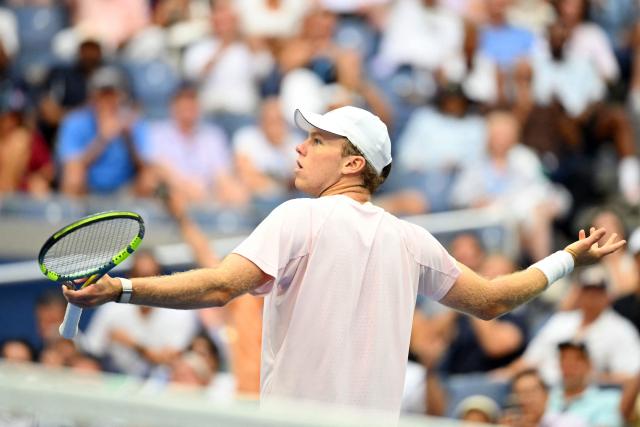USA's Alex Michelsen reacts during his men's singles quarter-final tennis match against USA's Frances Tiafoe on day ten of the US Open tennis tournament at the USTA Billie Jean King National Tennis Center in New York City on September 8, 2026. (Photo by ANGELA WEISS / AFP)