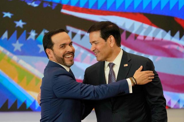 Colombia's President Abelardo de la Espriella (L) and US Secretary of State Marco Rubio (R) embrace during a bilateral agreements signing ceremony in Barranquilla, Colombia on September 8, 2026. (Photo by Fernando Vergara / POOL / AFP)