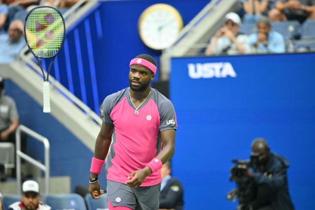 USA's Frances Tiafoe tosses his racquet as he plays USA's Alex Michelsen in their men's singles quarter-final tennis match on day ten of the US Open tennis tournament at the USTA Billie Jean King National Tennis Center in New York on September 8, 2026. (Photo by ANGELA WEISS / AFP)