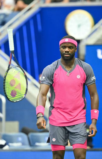 USA's Frances Tiafoe tosses his racquet as he plays USA's Alex Michelsen in their men's singles quarter-final tennis match on day ten of the US Open tennis tournament at the USTA Billie Jean King National Tennis Center in New York on September 8, 2026. (Photo by ANGELA WEISS / AFP)