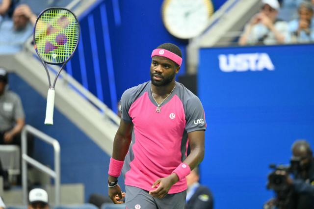 USA's Frances Tiafoe tosses his racquet as he plays USA's Alex Michelsen in their men's singles quarter-final tennis match on day ten of the US Open tennis tournament at the USTA Billie Jean King National Tennis Center in New York on September 8, 2026. (Photo by ANGELA WEISS / AFP)