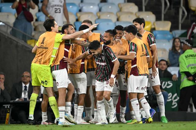 Fluminense's midfielder #16 Nonato (C) celebrates with teammates after scoring a goal during the Copa Libertadores quarter-final first leg football match between Brazil's Fluminense and Argentina's Platense at the Maracana stadium in Rio de Janeiro, Brazil on September 8, 2026. (Photo by MAURO PIMENTEL / AFP)