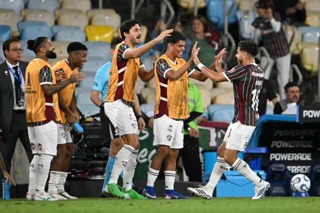 Fluminense's midfielder #16 Nonato (R) celebrates with teammates after scoring a goal during the Copa Libertadores quarter-final first leg football match between Brazil's Fluminense and Argentina's Platense at the Maracana stadium in Rio de Janeiro, Brazil on September 8, 2026. (Photo by MAURO PIMENTEL / AFP)