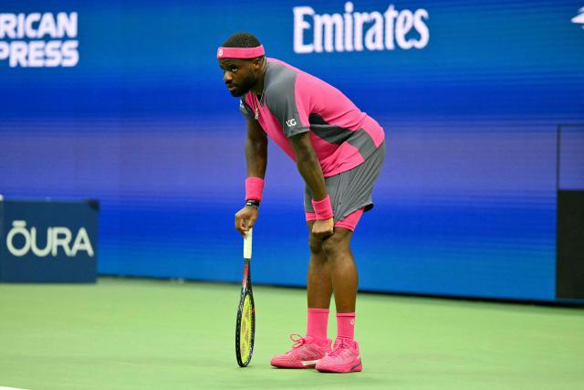 USA's Frances Tiafoe reacts as he plays USA's Alex Michelsen in their men's singles quarter-final tennis match on day ten of the US Open tennis tournament at the USTA Billie Jean King National Tennis Center in New York on September 8, 2026. (Photo by ANGELA WEISS / AFP)