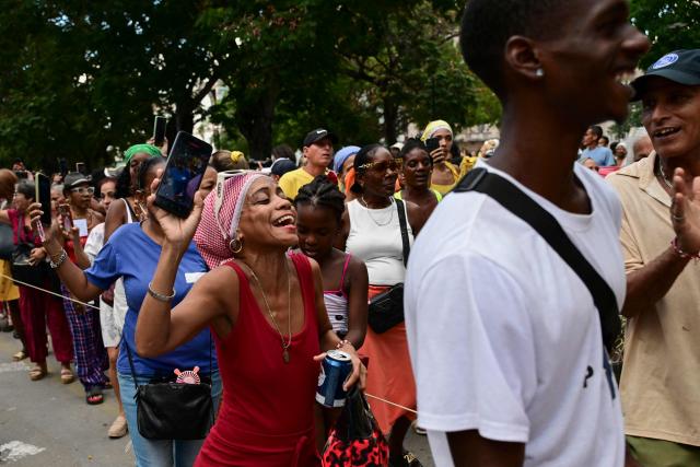 Followers of the Virgin of Charity, Oxun in the Yoruba religion, attend a procession during the Oxun Day celebrations in Havana on September 8, 2026. (Photo by YAMIL LAGE / AFP)