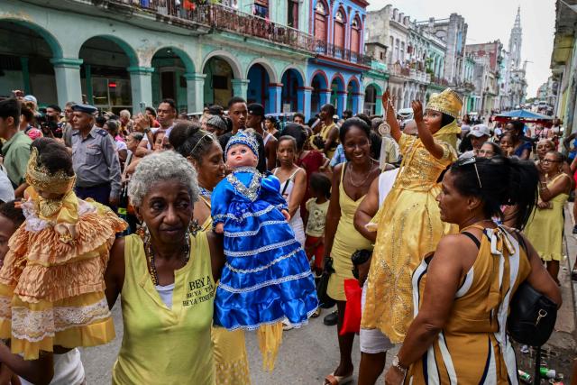 Followers of the Virgin of Charity, Oxun in the Yoruba religion, attend a procession during the Oxun Day celebrations in Havana on September 8, 2026. (Photo by YAMIL LAGE / AFP)