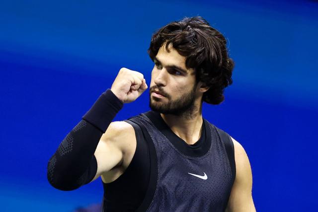 Spain's Carlos Alcaraz reacts after a point against USA's Ben Shelton during the men's singles quarter-final tennis match on day ten of the US Open tennis tournament at the USTA Billie Jean King National Tennis Center in New York City on September 8, 2026. (Photo by CHARLY TRIBALLEAU / AFP)
