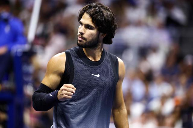 Spain's Carlos Alcaraz reacts after a point against USA's Ben Shelton during the men's singles quarter-final tennis match on day ten of the US Open tennis tournament at the USTA Billie Jean King National Tennis Center in New York City on September 8, 2026. (Photo by CHARLY TRIBALLEAU / AFP)