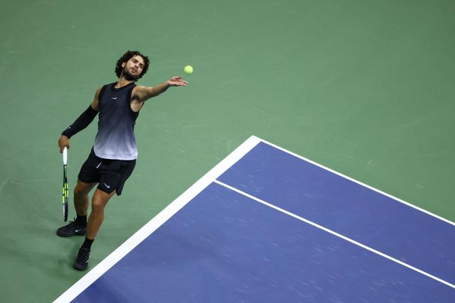 Spain's Carlos Alcaraz serves against USA's Ben Shelton during the men's singles quarter-final tennis match on day ten of the US Open tennis tournament at the USTA Billie Jean King National Tennis Center in New York City on September 8, 2026. (Photo by Leonardo MUNOZ / AFP)
