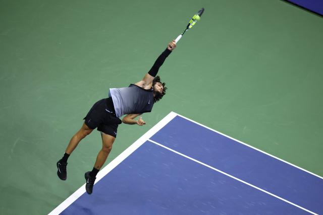 Spain's Carlos Alcaraz serves against USA's Ben Shelton during the men's singles quarter-final tennis match on day ten of the US Open tennis tournament at the USTA Billie Jean King National Tennis Center in New York City on September 8, 2026. (Photo by Leonardo MUNOZ / AFP)