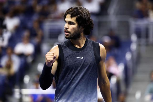 Spain's Carlos Alcaraz reacts after a point against USA's Ben Shelton during the men's singles quarter-final tennis match on day ten of the US Open tennis tournament at the USTA Billie Jean King National Tennis Center in New York City on September 8, 2026. (Photo by CHARLY TRIBALLEAU / AFP)