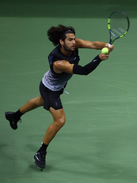 Spain's Carlos Alcaraz hits a return against USA's Ben Shelton during the men's singles quarter-final tennis match on day ten of the US Open tennis tournament at the USTA Billie Jean King National Tennis Center in New York City on September 8, 2026. (Photo by Leonardo MUNOZ / AFP)