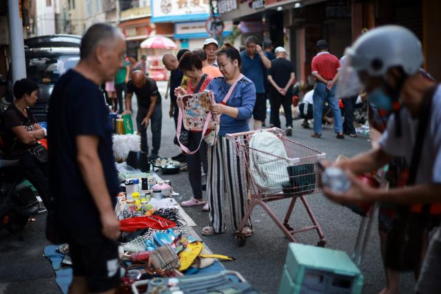 People visit a second-hand market in Xiamen, in China’s eastern Fujian province on September 9, 2026. (Photo by CN-STR / AFP) / China OUT
